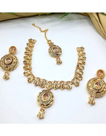 Elegant Golden Jewelry Set with Earrings & Tikka